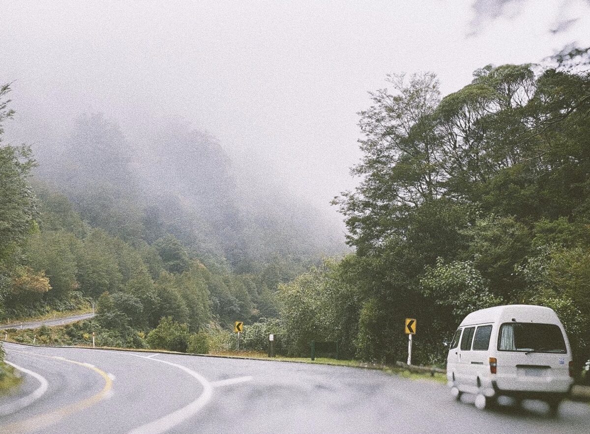 A campervan parked on the side of the road in Mt. Aspiring National Park, New Zealand.