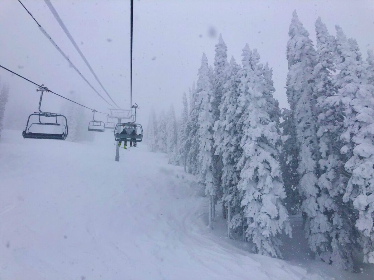 Vantage point from a snowy ski lift in Colorado.