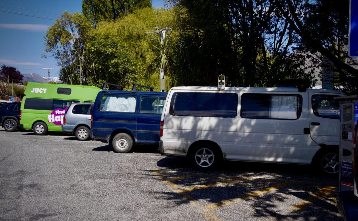 A few converted campervans parked in Queenstown, NZ.