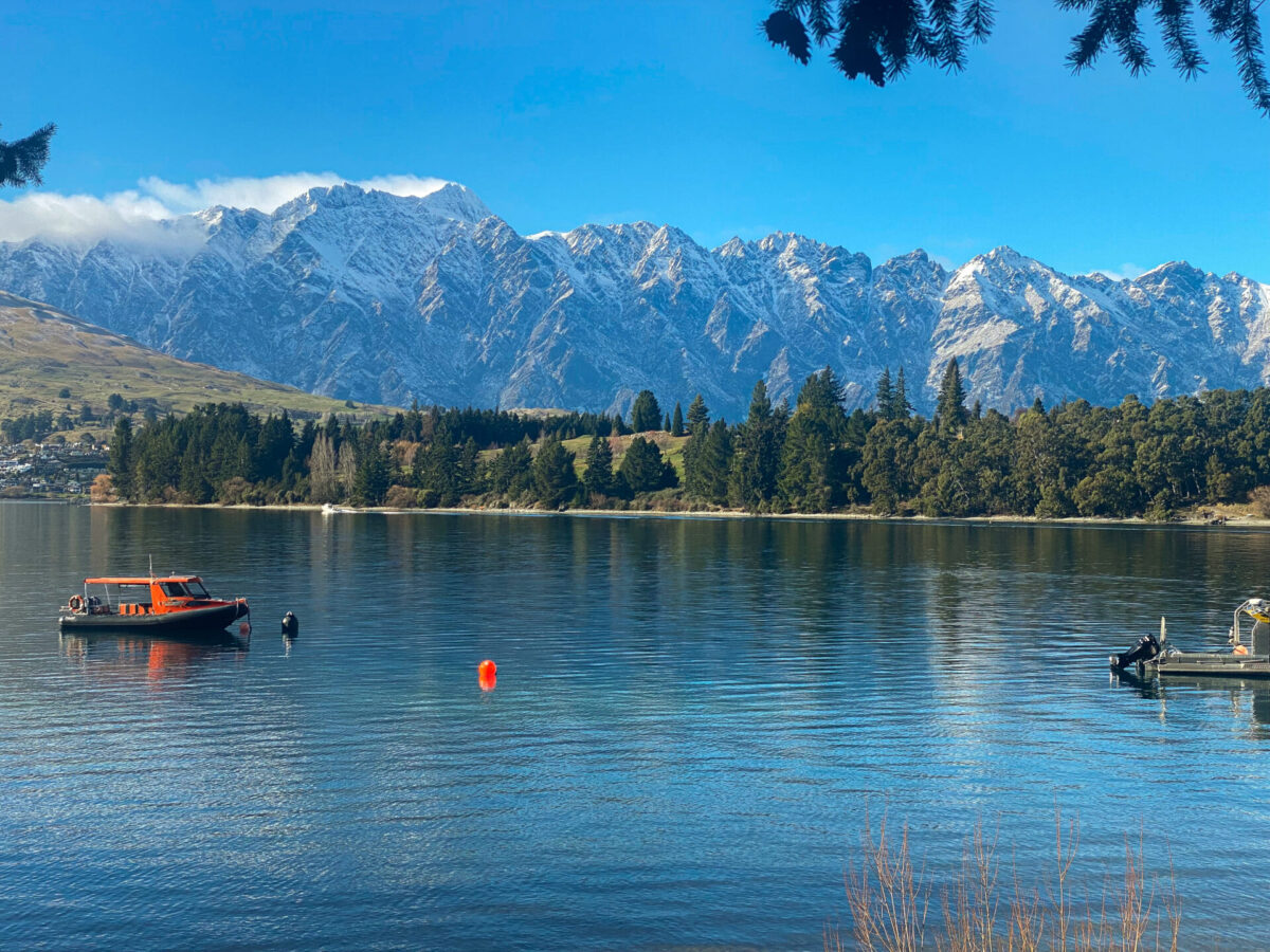 A snowy view of the Remarkables mountain range over Lake Wakatipu in Queenstown, NZ