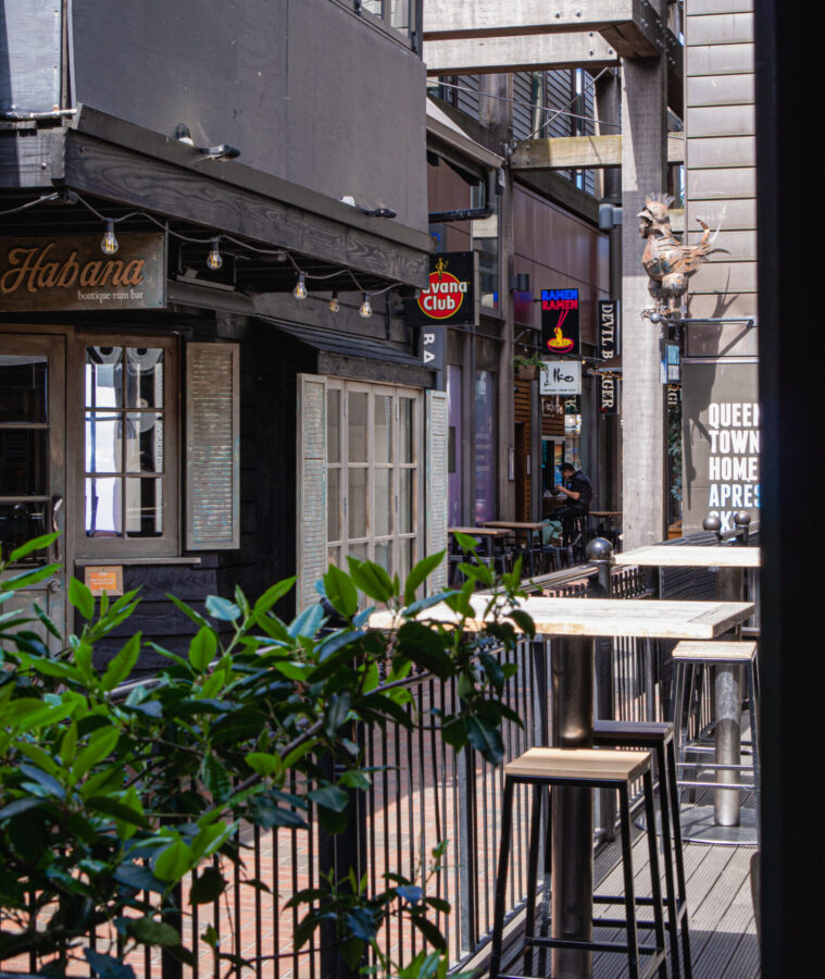 An alleyway in Queenstown, NZ with several bars and restaurants.