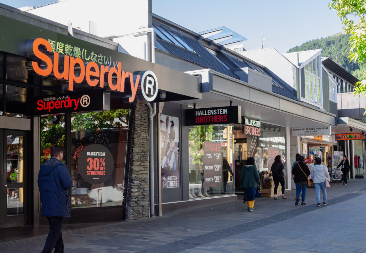 A strip of clothing stores and gift shops in Queenstown, NZ