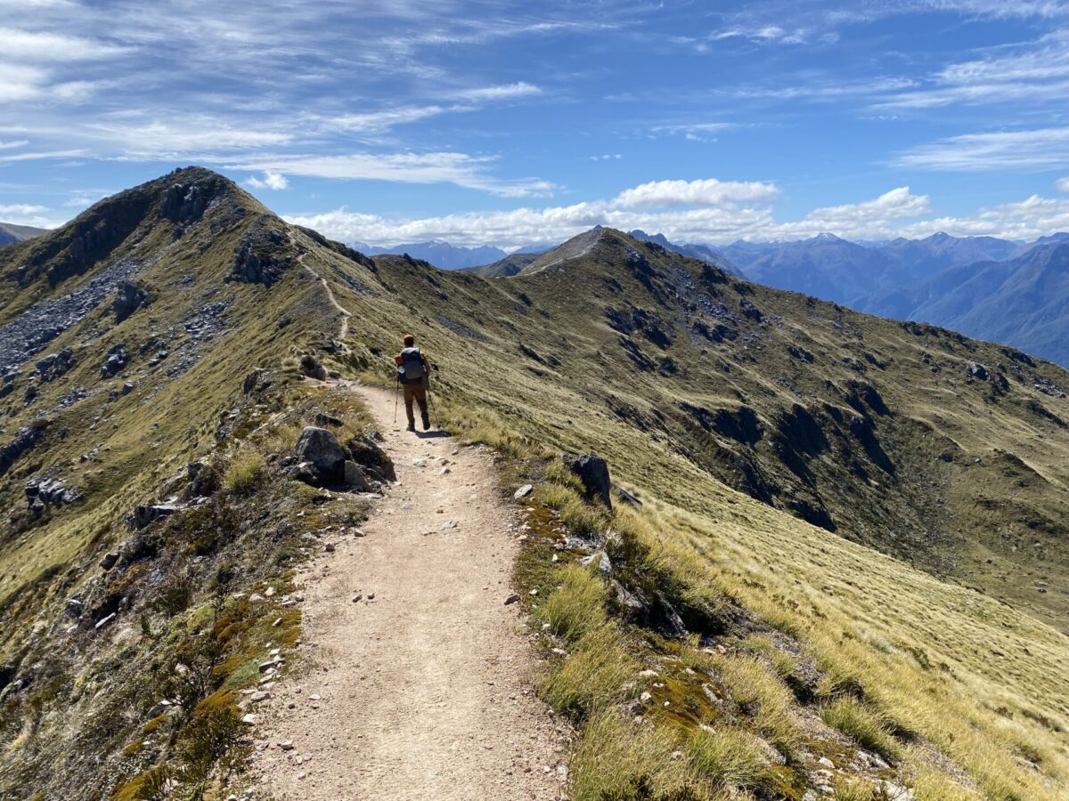A hiker and some views from atop the Kepler Track in Fiordland National Park.