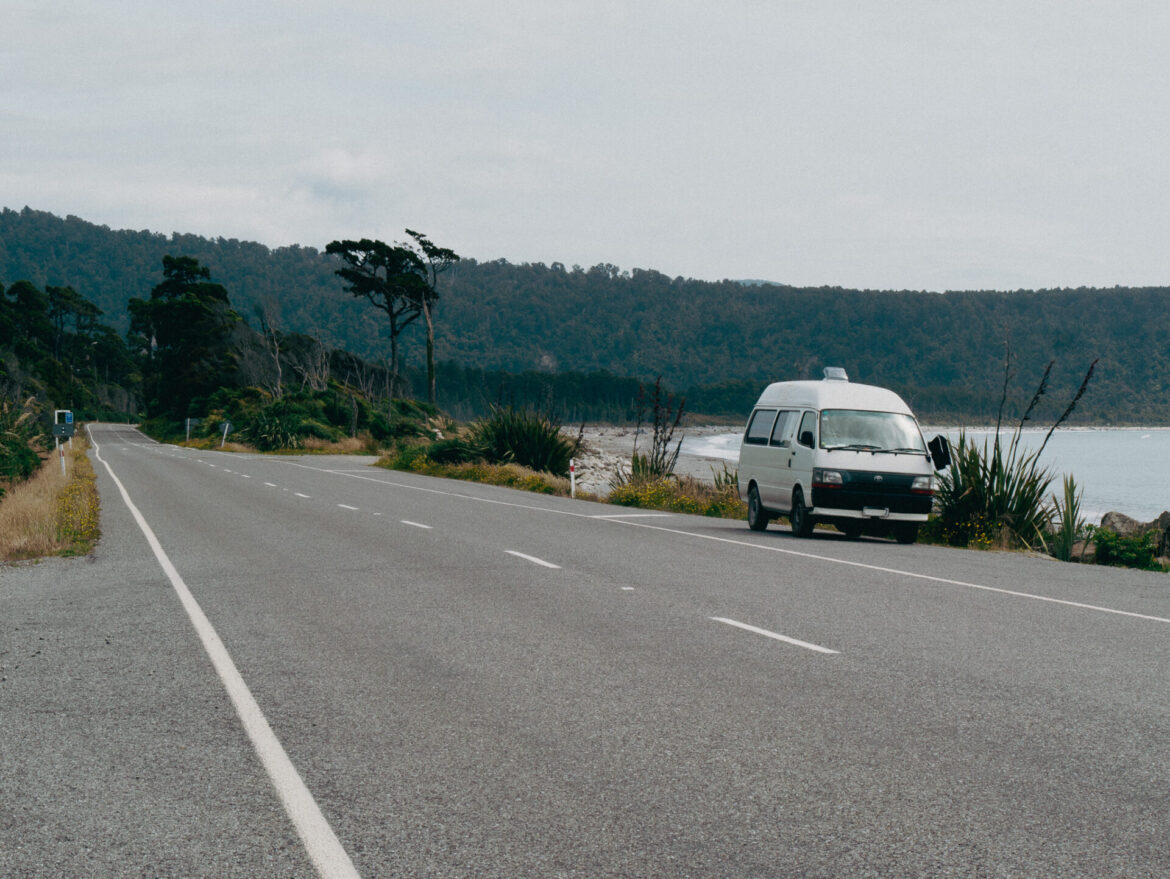 A van parked near the beach on New Zealand's west coast.