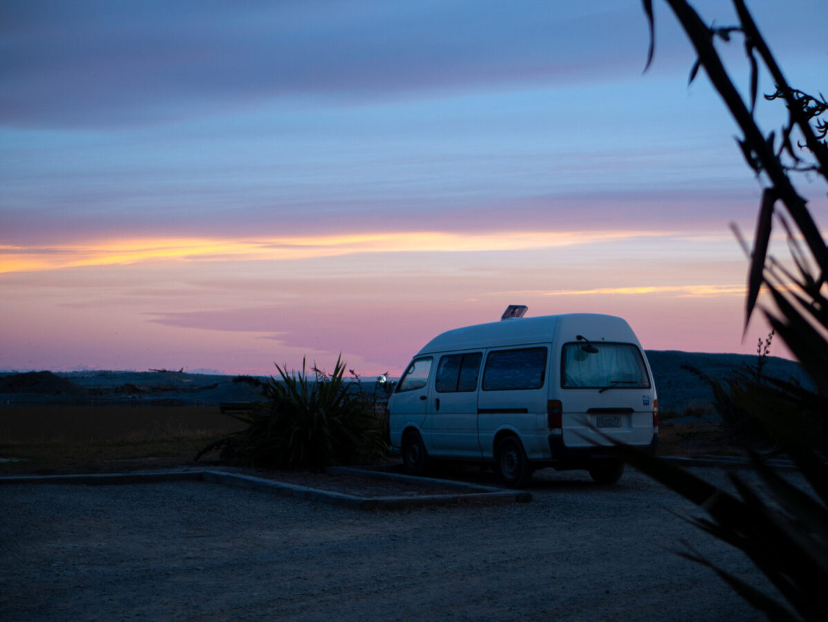 A converted campervan parked at a freedom camping site in New Zealand.