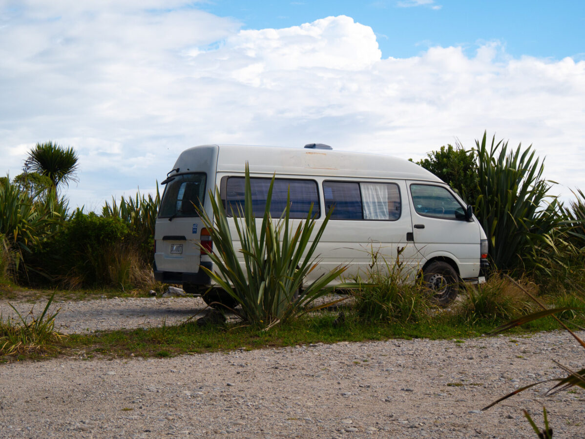 A converted van parked near the beach on the South Island of New Zealand.