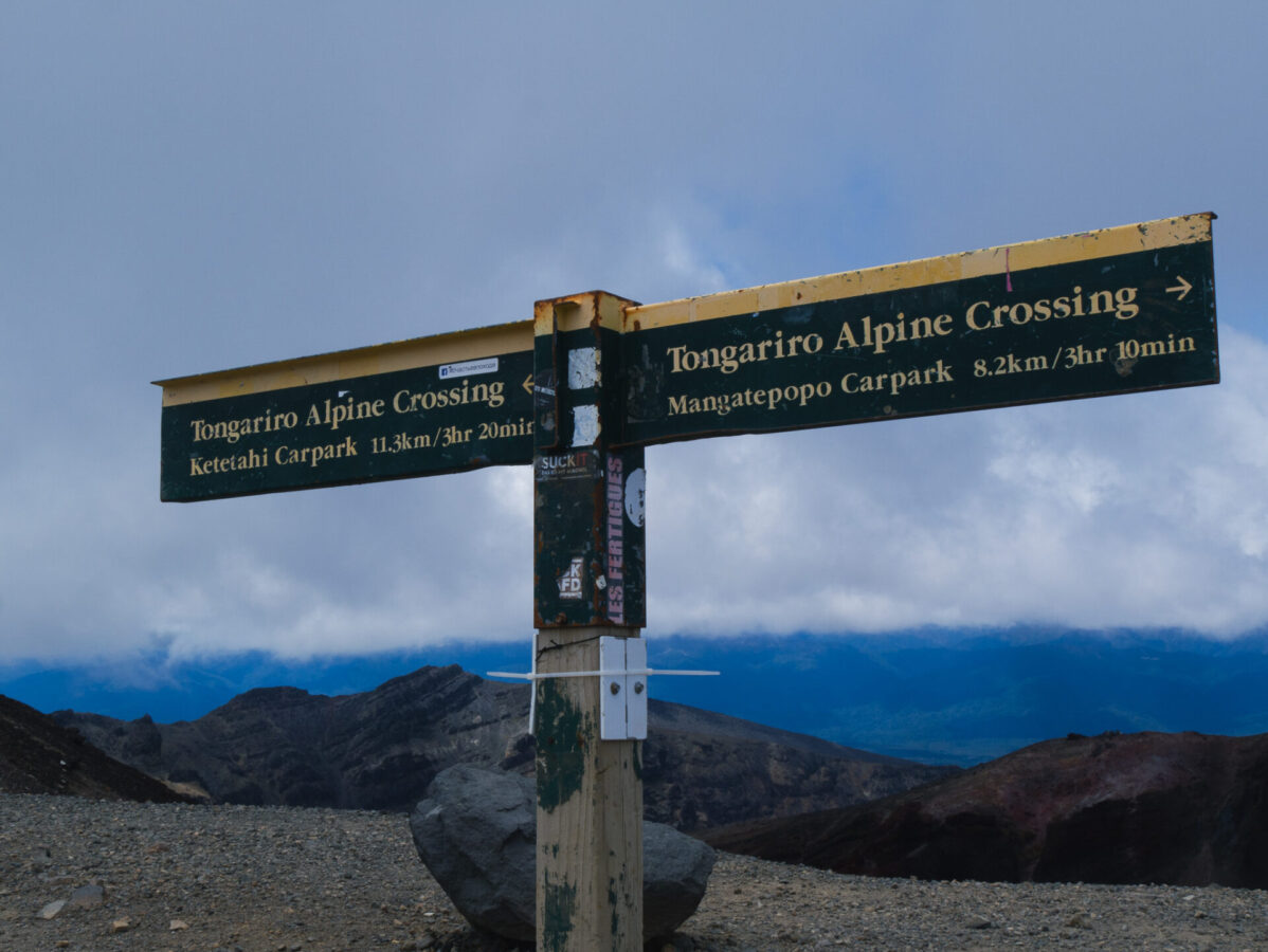A sign on the Tongariro Alpine Crossing indicating where the trail leads.