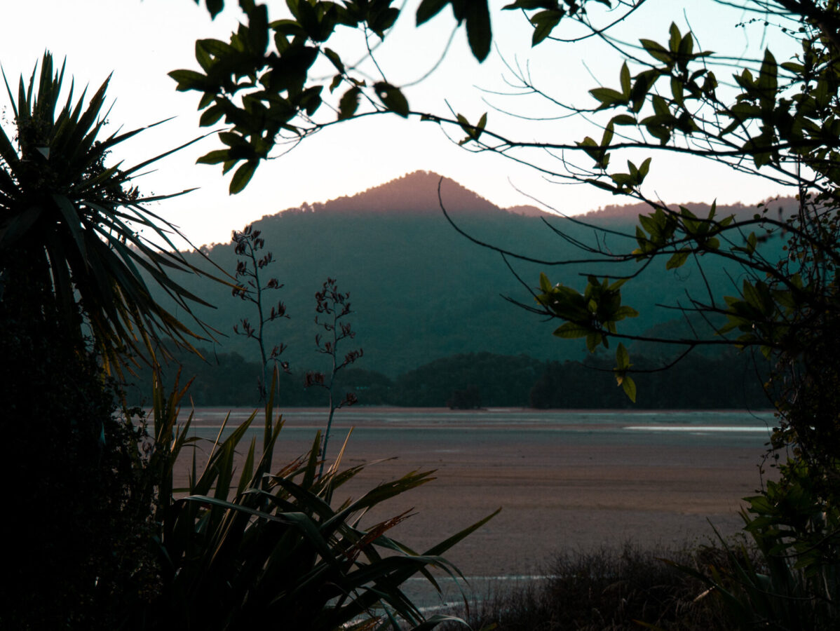 A sunset view from Awaroa campsite on the Abel Tasman Track in New Zealand.