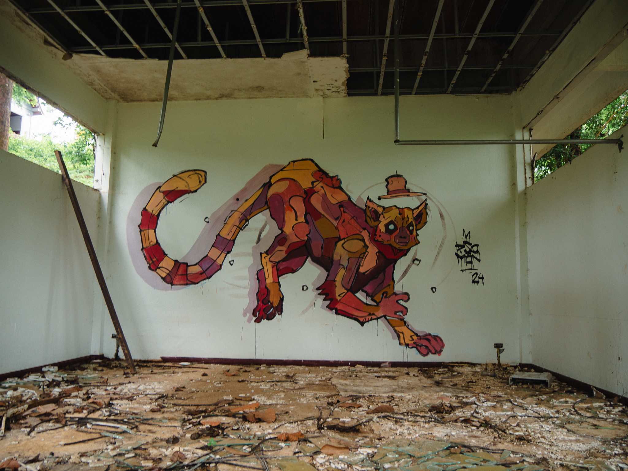 A mural found in a rundown, abandoned building at a resort on the Bolaven Plateau, Laos.