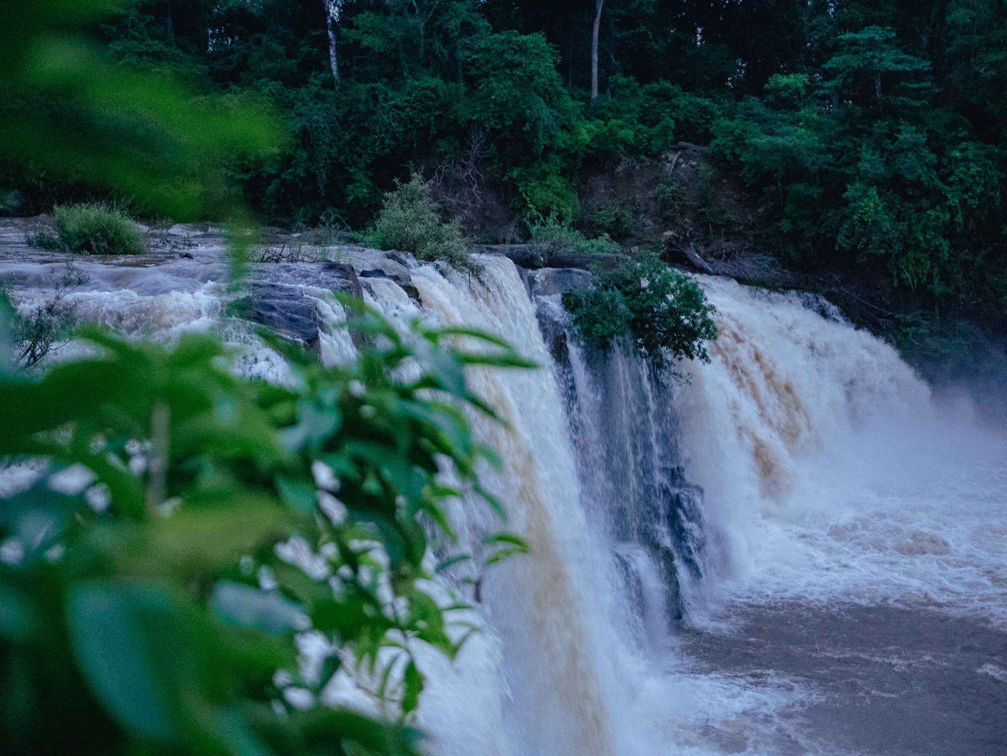 A side view of the Tad Lo waterfall along the Bolaven Plateau Loop in southern Laos.