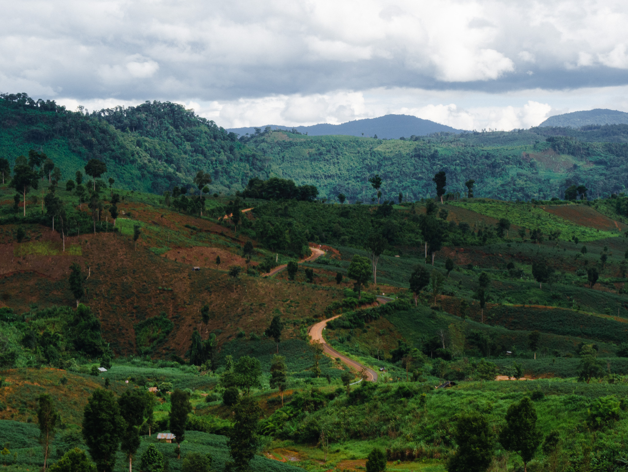 A scenic view of the mountainous Bolaven Plateau region in southern Laos.