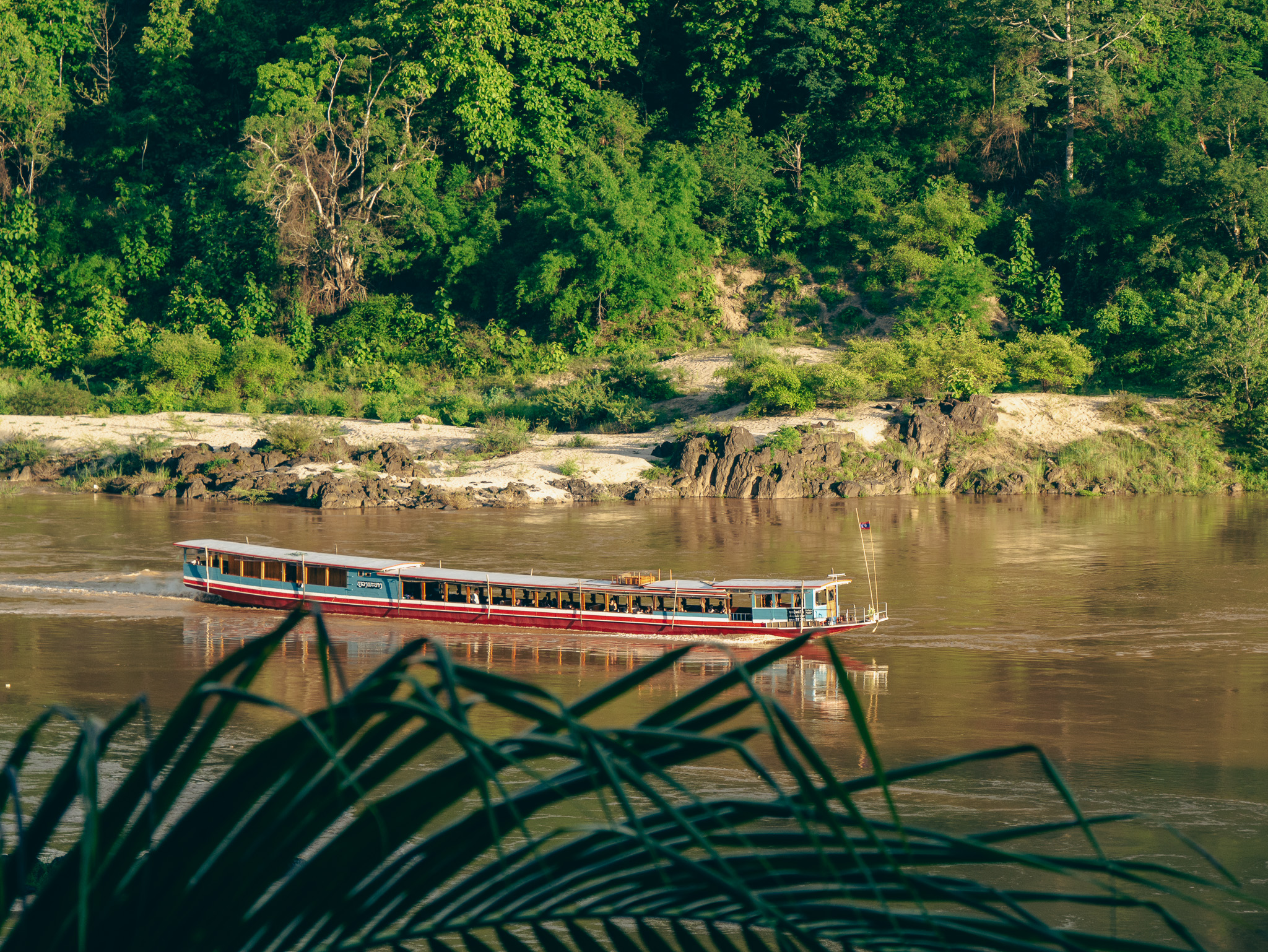 A slow boat moving down Laos' Mekong River.